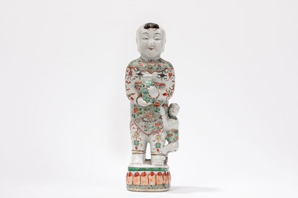 A FAMILLE VERTE FIGURE OF A BOY