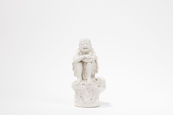A BLANC-DE-CHINE PORCELAIN FIGURES